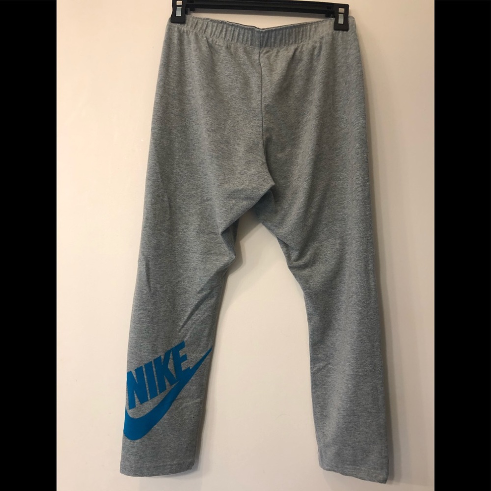Nike leggings. 3/4 length. Grey w/teal logo.